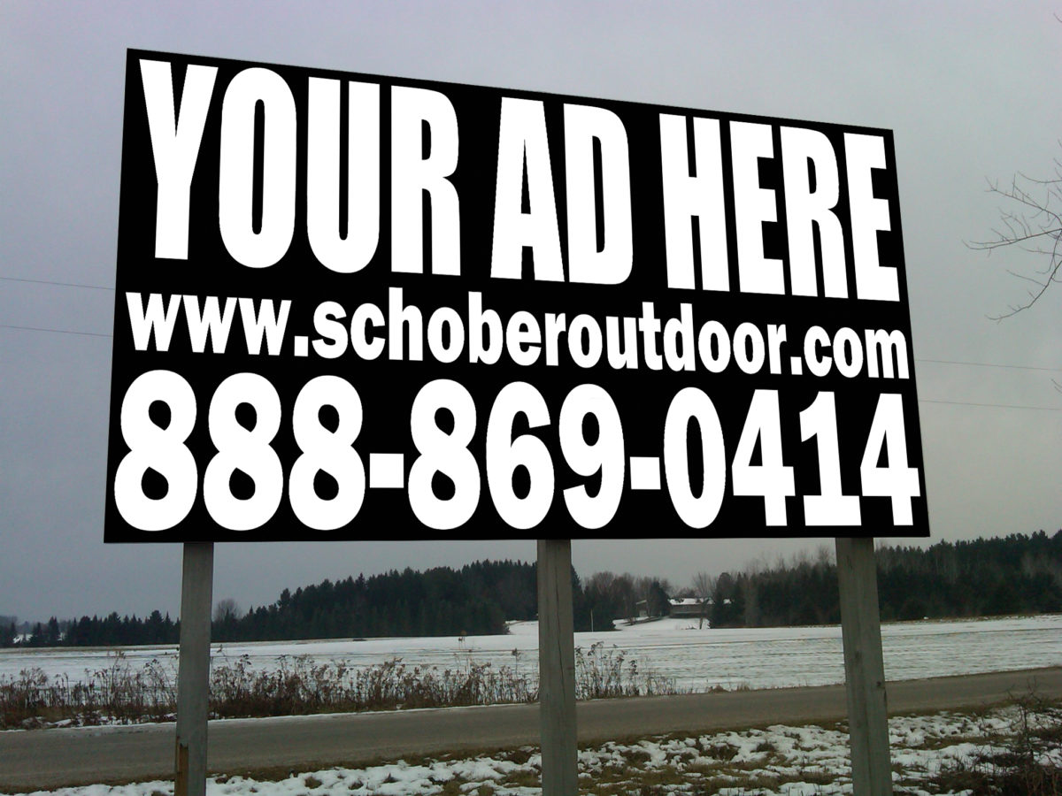 Billboard advertising space with contact information.